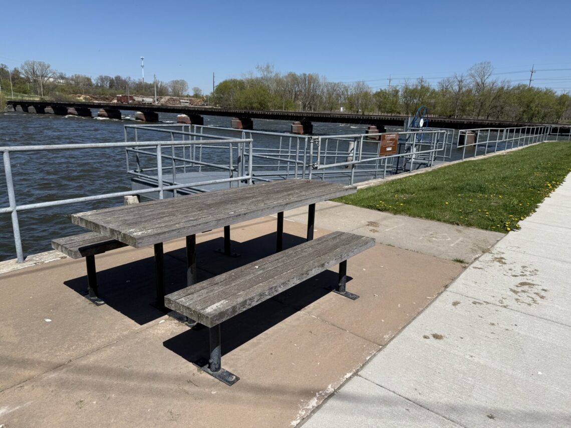 Picture of a picnic table next to a kayak boat launch
