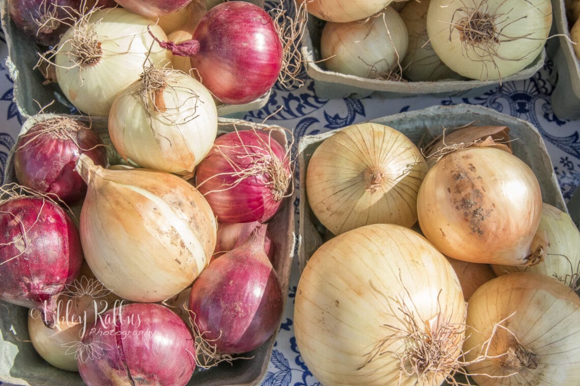 Baskets of onions and shallots