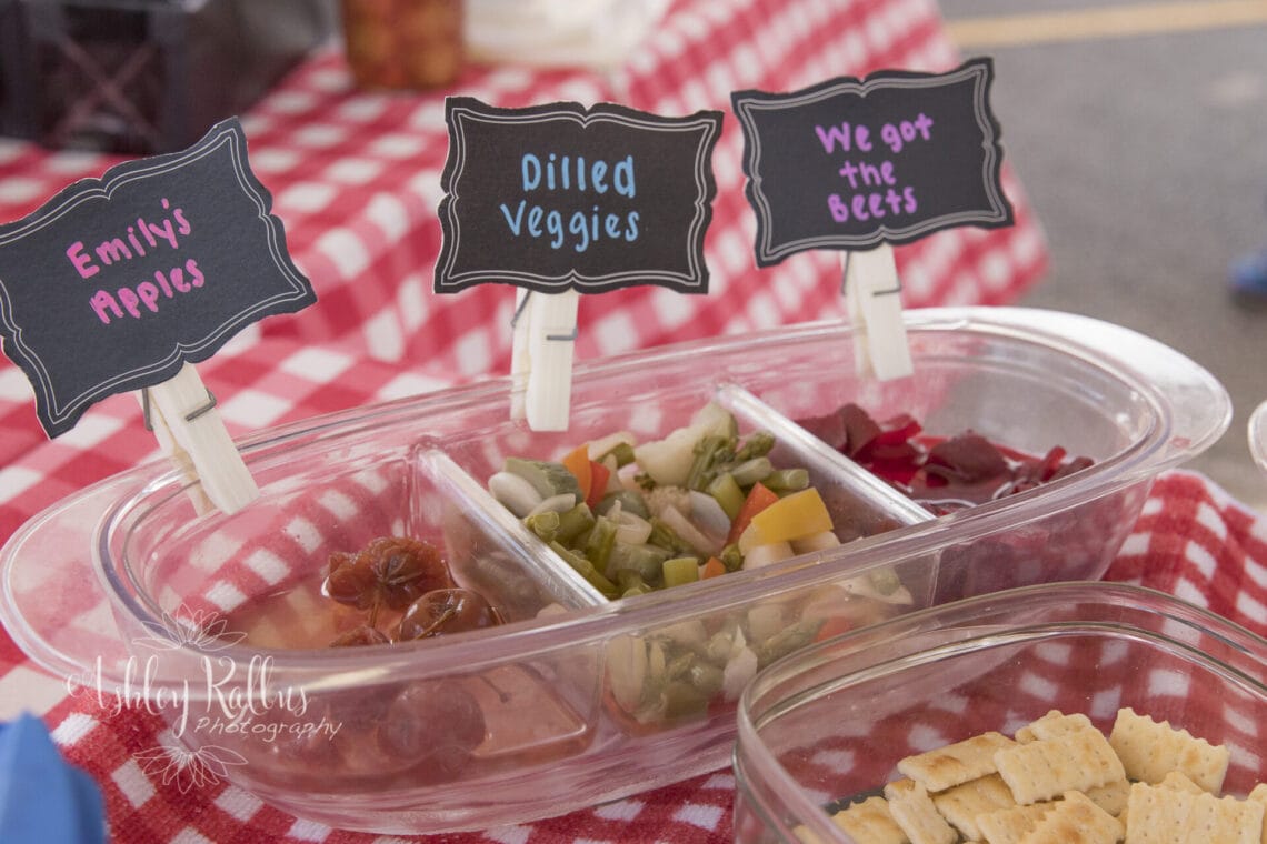 Sampling tray of apples, dilled vegetables and beets