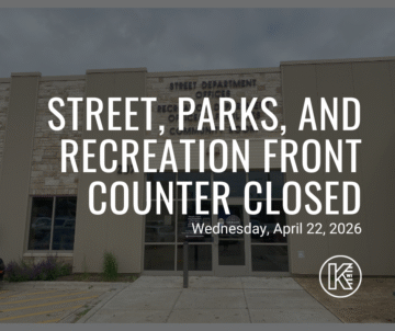 The image shows a building with a sign that reads, 