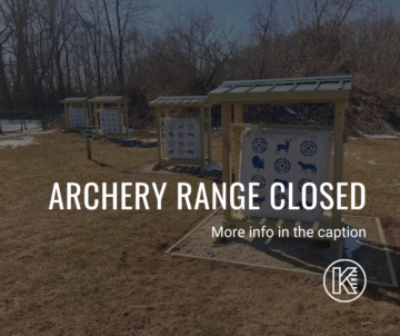 Outdoor archery range with targets covered. Text overlay reads: 