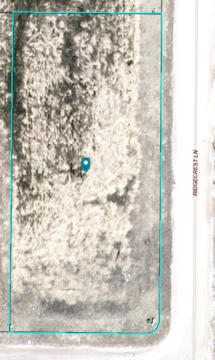 Aerial view of the property in the shape of a rectangle running along Ridgecrest Lane. Looks to be a corner property