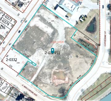 Aerial view of the property looking roughly square shaped with sides along Catherine Street, Kwik Trip, State Highway 55, and East Wisconsin Avenue