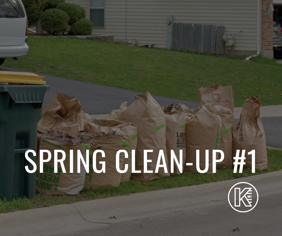 Picture showing yard waste bags waiting for pick up with the words spring clean up #1 and the City of Kaukauna Logo on the bottom